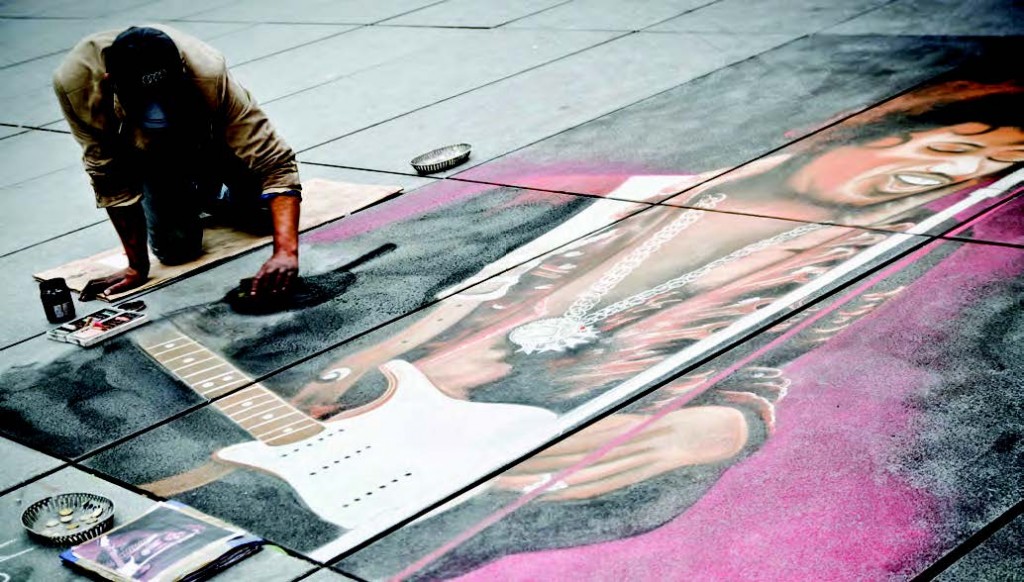 Artista pintando en la Place Stravinski.